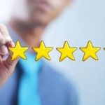 Individual in professional attire marking a high rating with five yellow stars for Boutwell's Air Masters HVAC services.